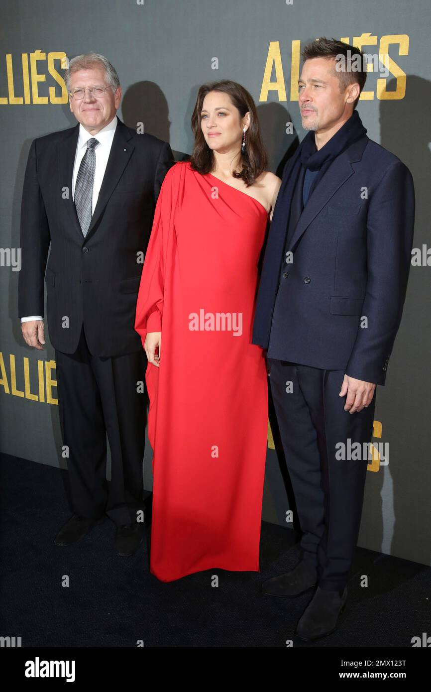 Robert Zemeckis, left, poses with Marion Cotillard and Brad Pitt during