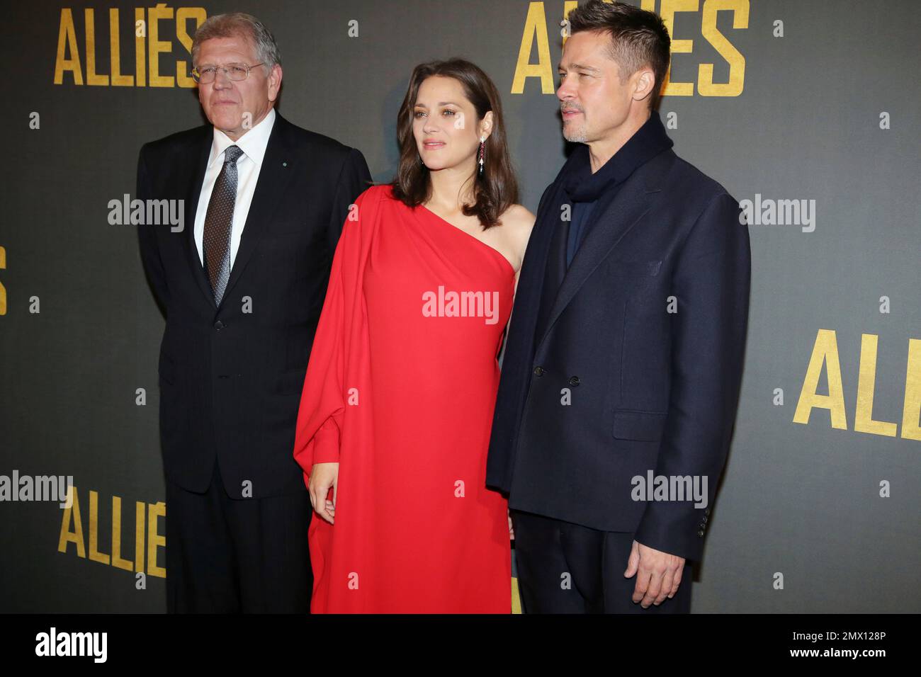 Robert Zemeckis, left, poses with Marion Cotillard and Brad Pitt during
