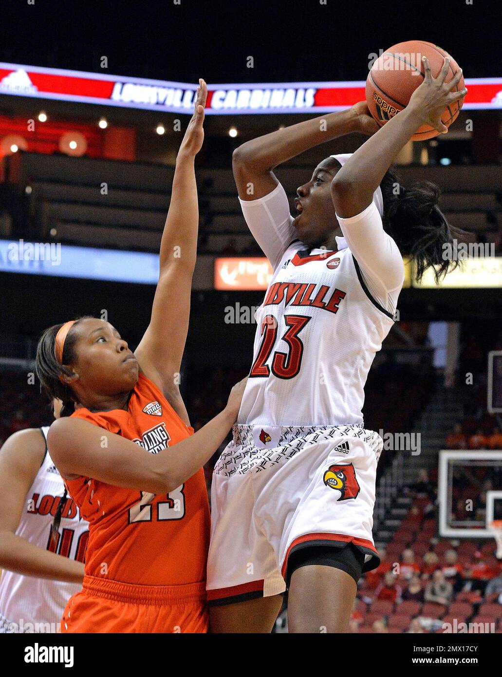Louisville's Jazmine Jones (23) shoots over the defense of Bowling