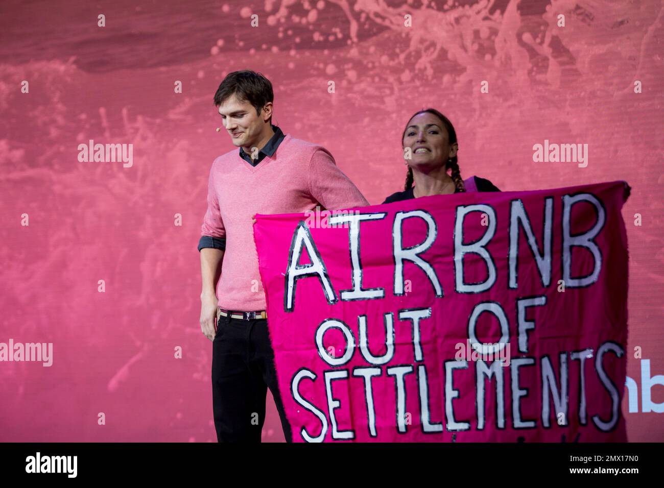 Ashton Kutcher interrupted by a protester at a panel during the Airbnb(00)