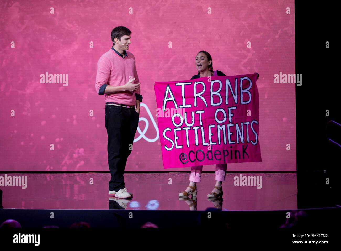 Ashton Kutcher interrupted by a protester at a panel during the Airbnb