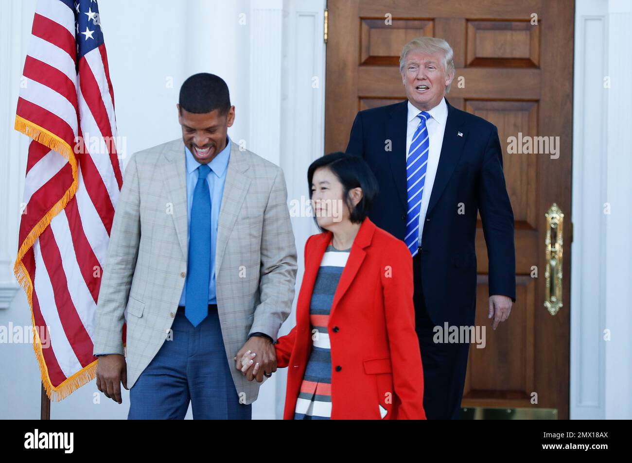 President-elect Donald Trump looks on as Michelle Rhee, a former ...