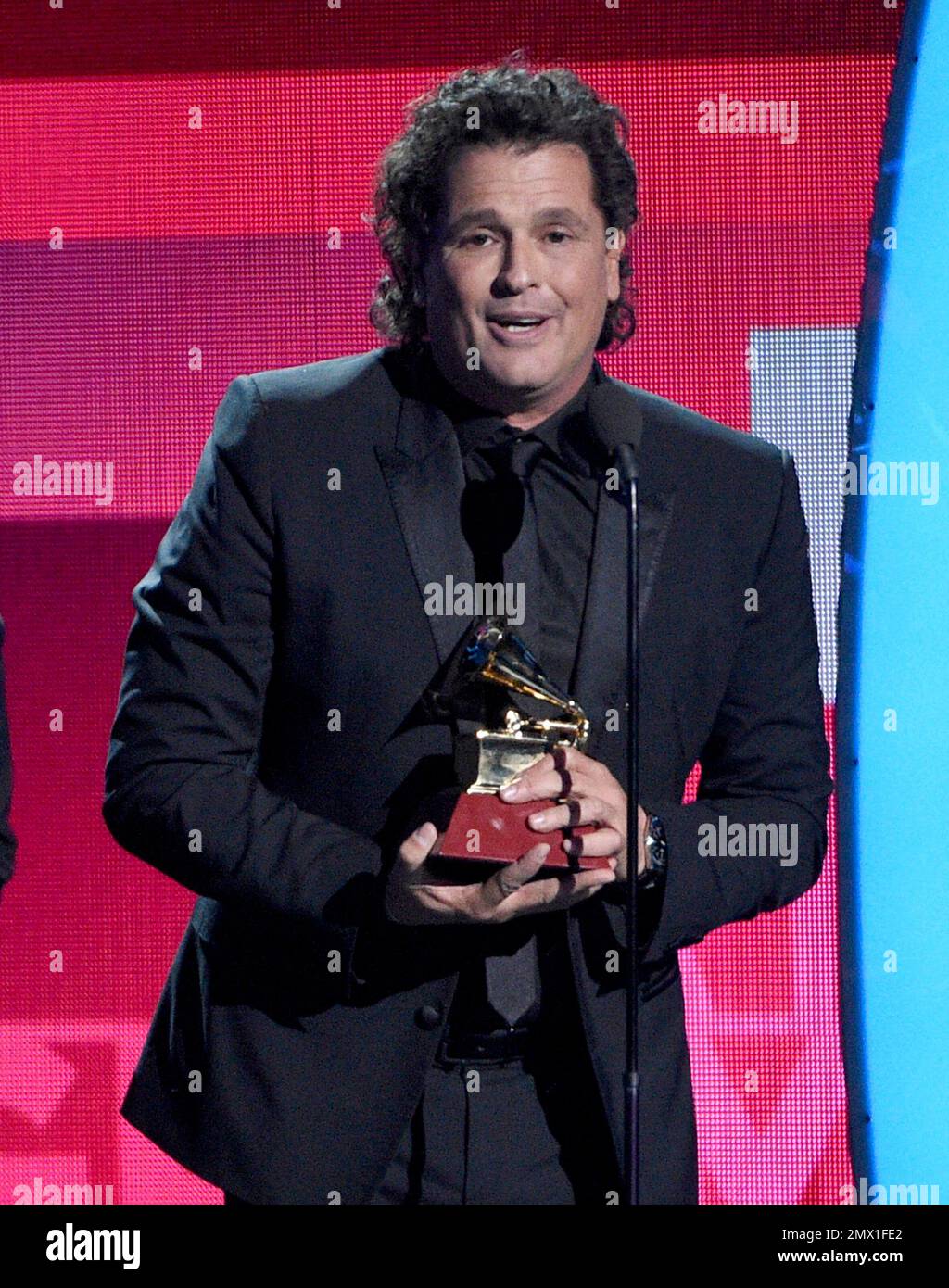 Carlos Vives accepts the award for record of the year for "La Bicicleta