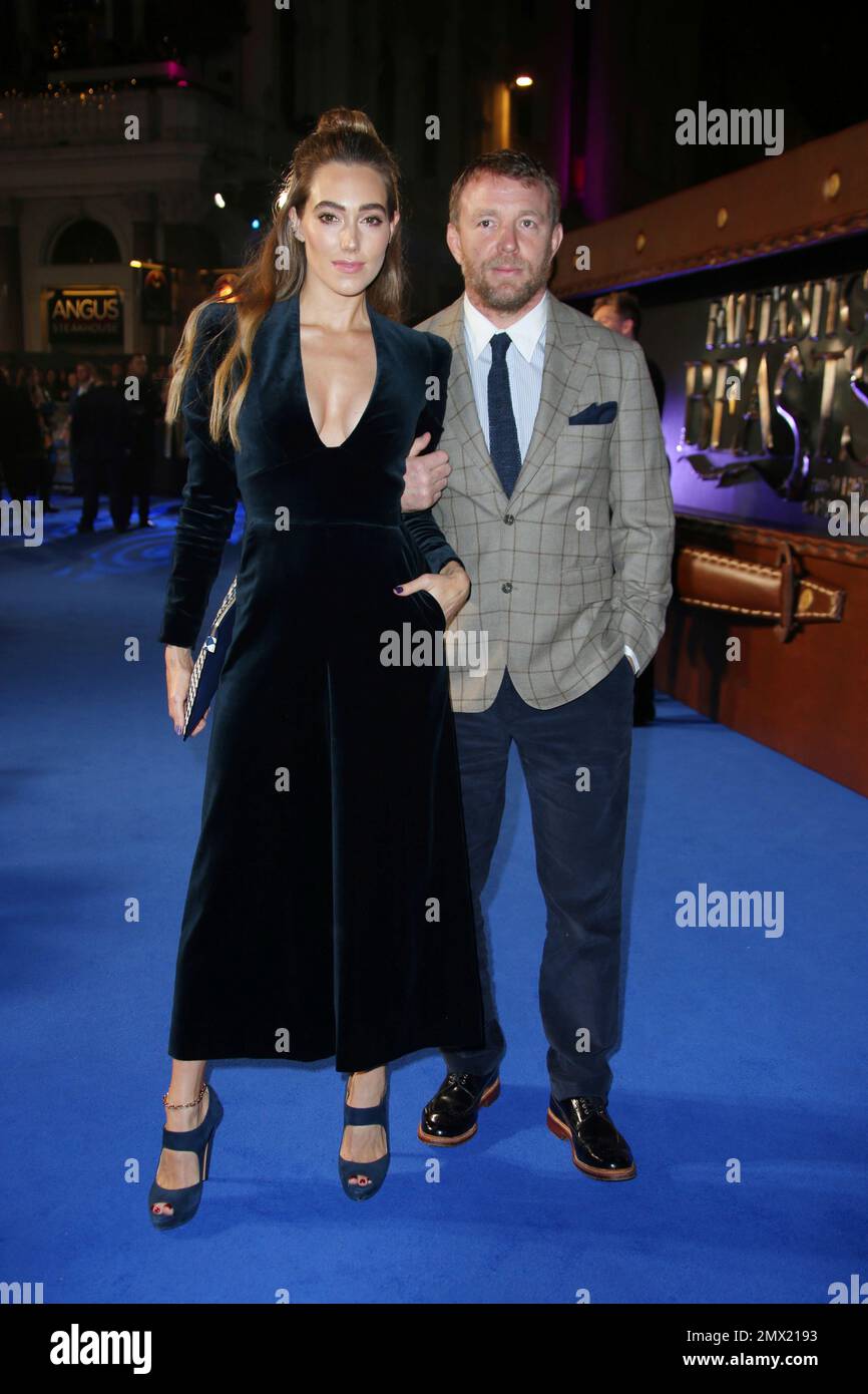 Director Guy Ritchie, right, and his wife Jacqui Ainsley pose for ...