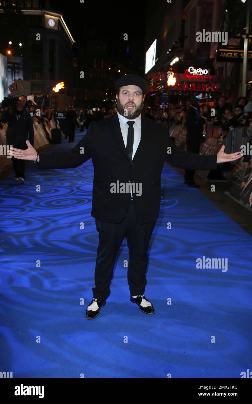 Actor Dan Fogler poses for photographers upon arrival at the premiere