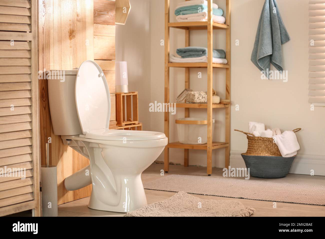 Modern toilet bowl in stylish bathroom interior Stock Photo - Alamy