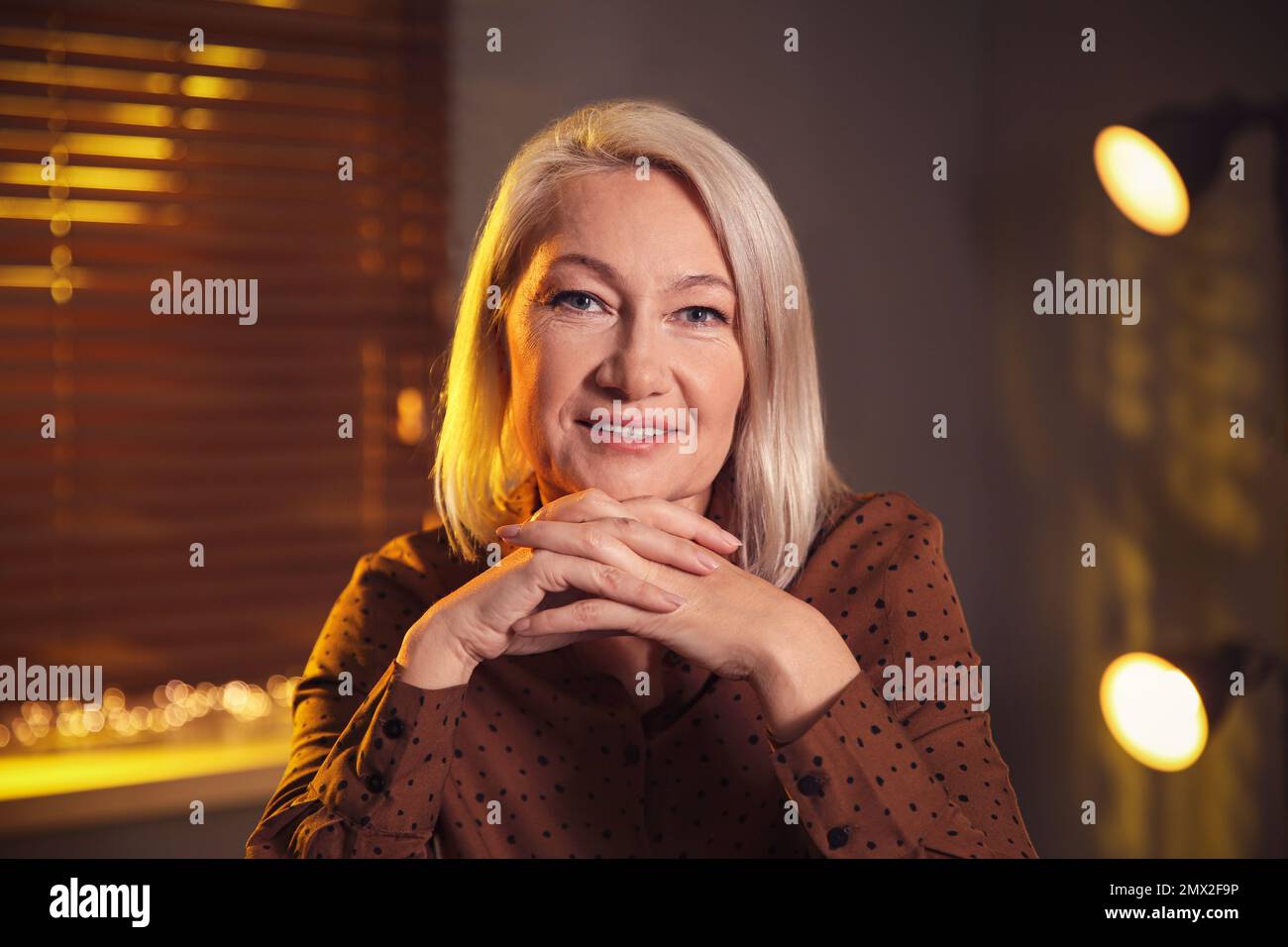 Portrait of beautiful mature woman at home Stock Photo - Alamy