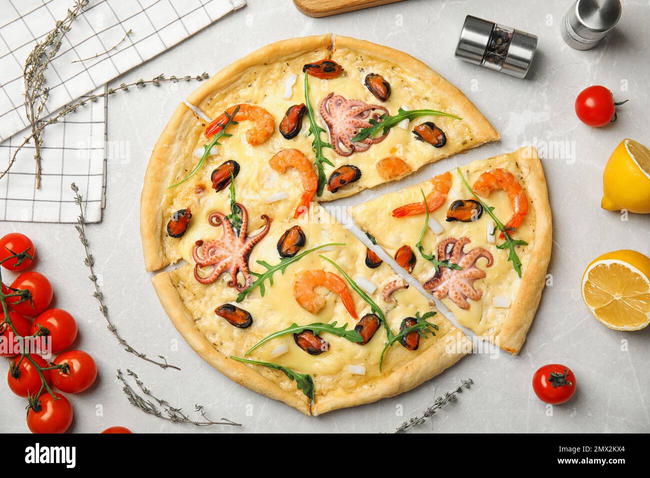 Delicious seafood pizza on grey marble table, flat lay Stock Photo - Alamy