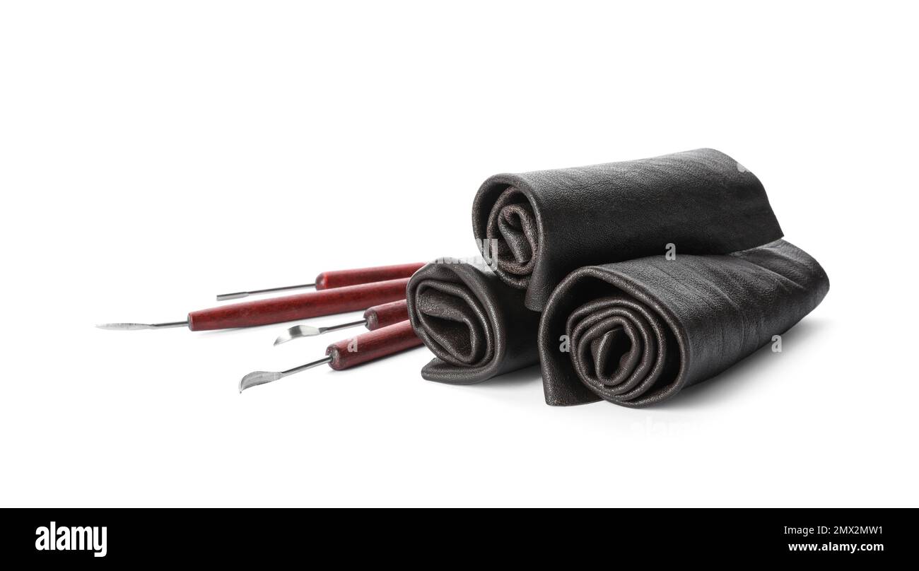 Leather samples and craftsman tools isolated on white Stock Photo