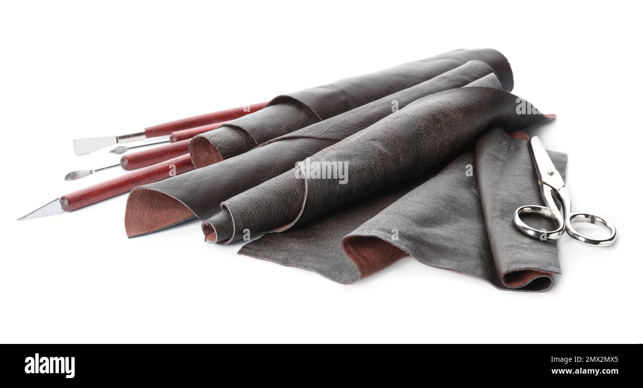 Leather samples and craftsman tools isolated on white Stock Photo