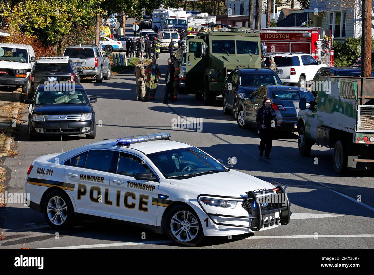 Police vehicles line streets of the Canonsburg, Pa., neighborhood where two Canonsburg police