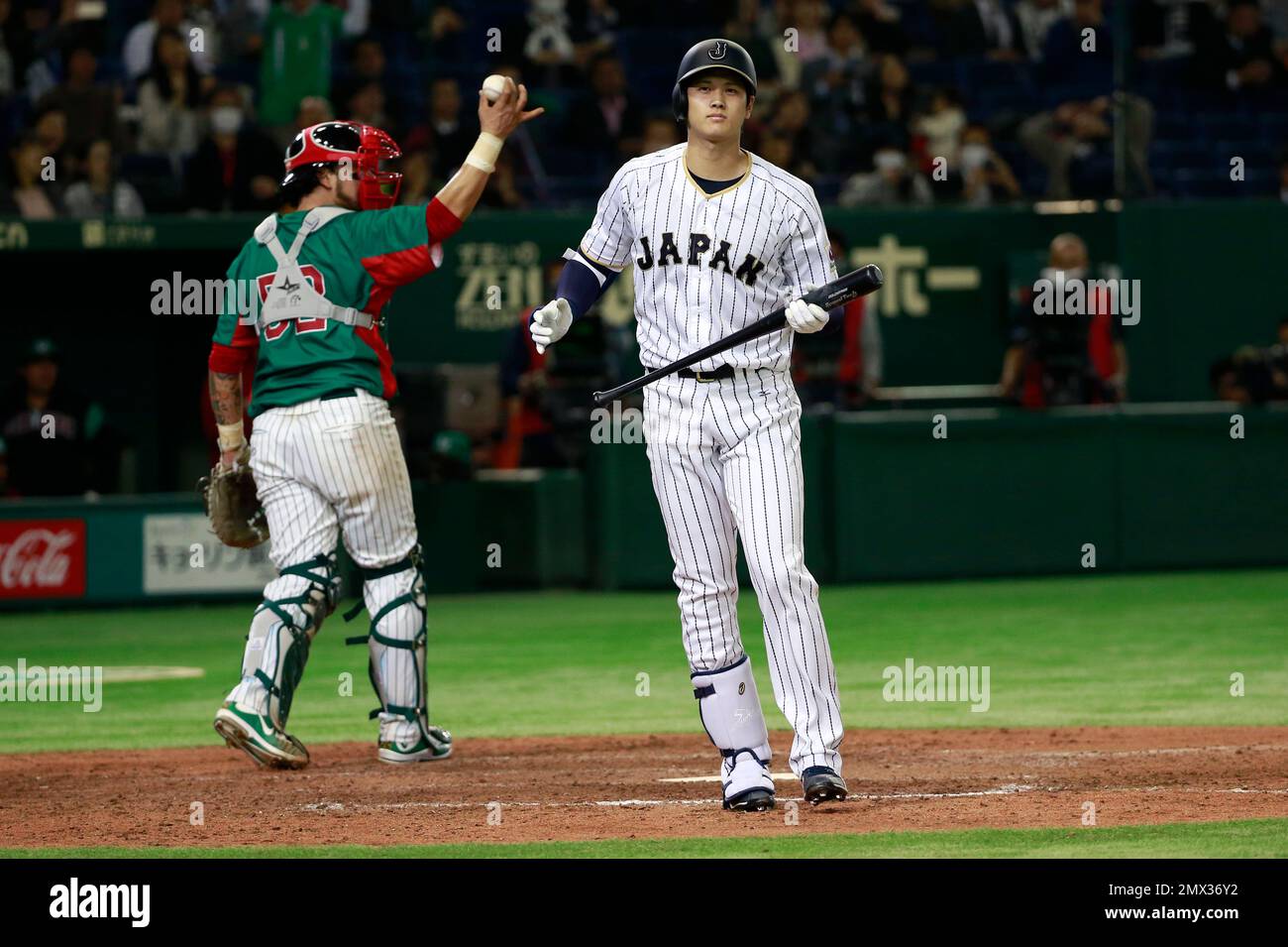 Japan's pinch hitter Shohei Otani reacts after a strikeout swinging as