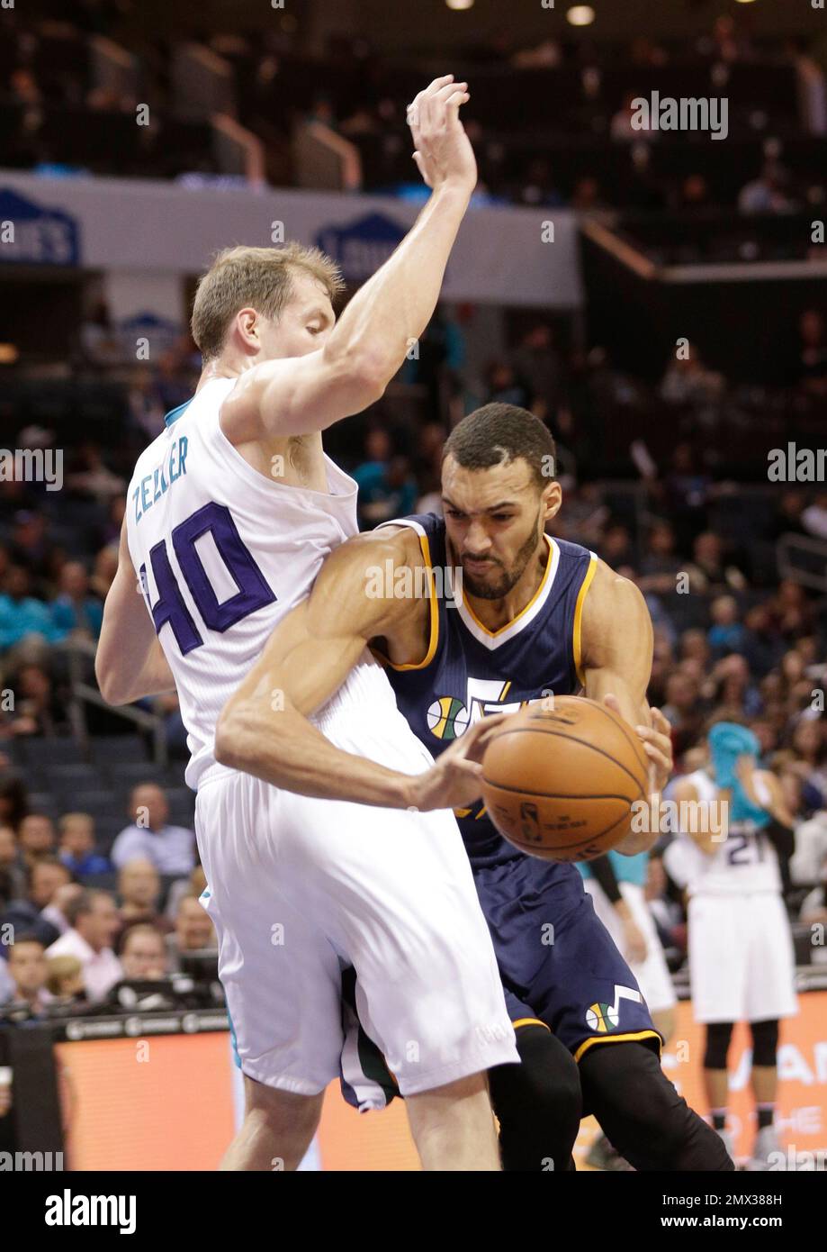 Utah Jazz's Rudy Gobert, right, drives against Charlotte Cody