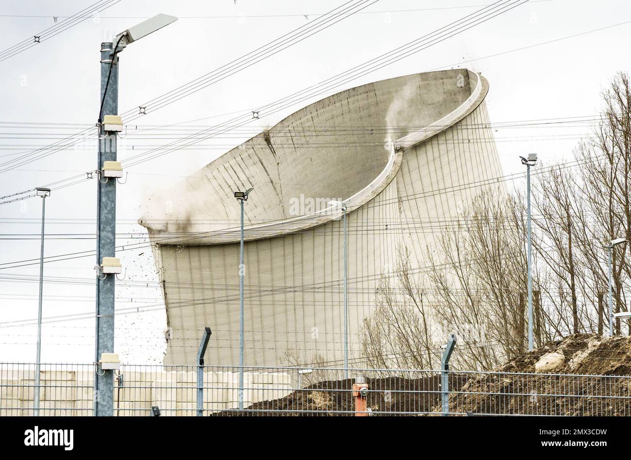 Biblis, Germany. 02nd Feb, 2023. One of the four cooling towers of the decommissioned Biblis nuclear power plant collapses during demolition. It was not blown up, but destabilized with excavators until it collapsed. The nuclear power plant was decommissioned after Germany's nuclear phase-out in the wake of the Fukushima disaster in 2011. Credit: Frank Rumpenhorst/dpa/Frank Rumpenhorst/dpa/Alamy Live News Stock Photo