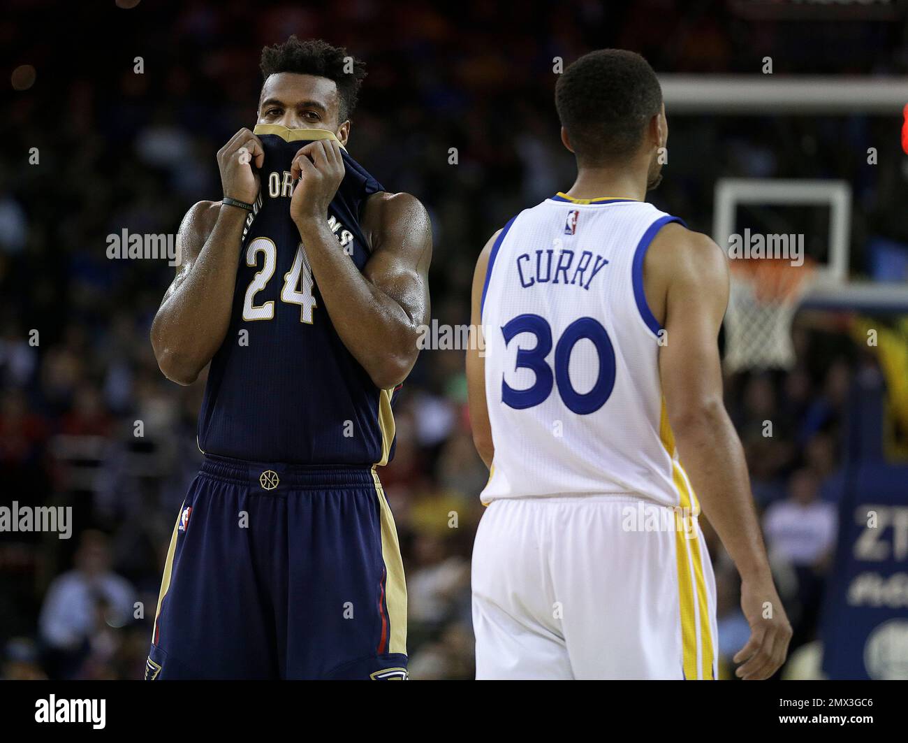 New Orleans Pelicans Buddy Hield left pulls his jersey over his face as Golden State Warriors Stephen Curry 30 passes during the second half of an NBA basketball game Monday Nov. 7