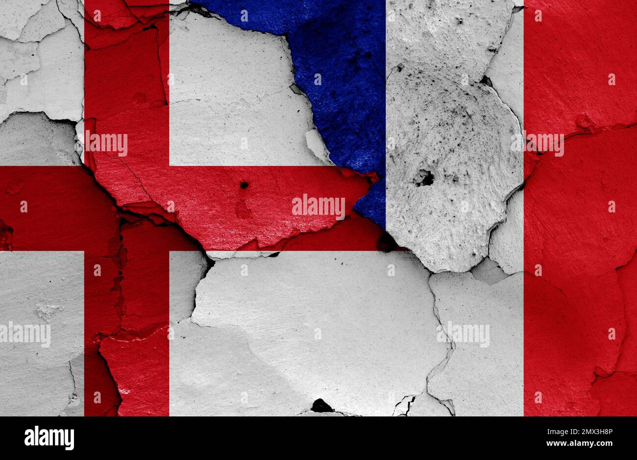 flags of England and France painted on cracked wall Stock Photo