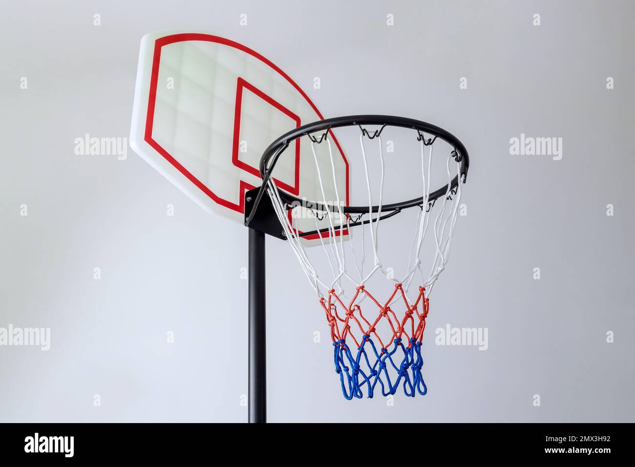 Isolated on white background is basketball basket hoop with rim and net Stock Photo