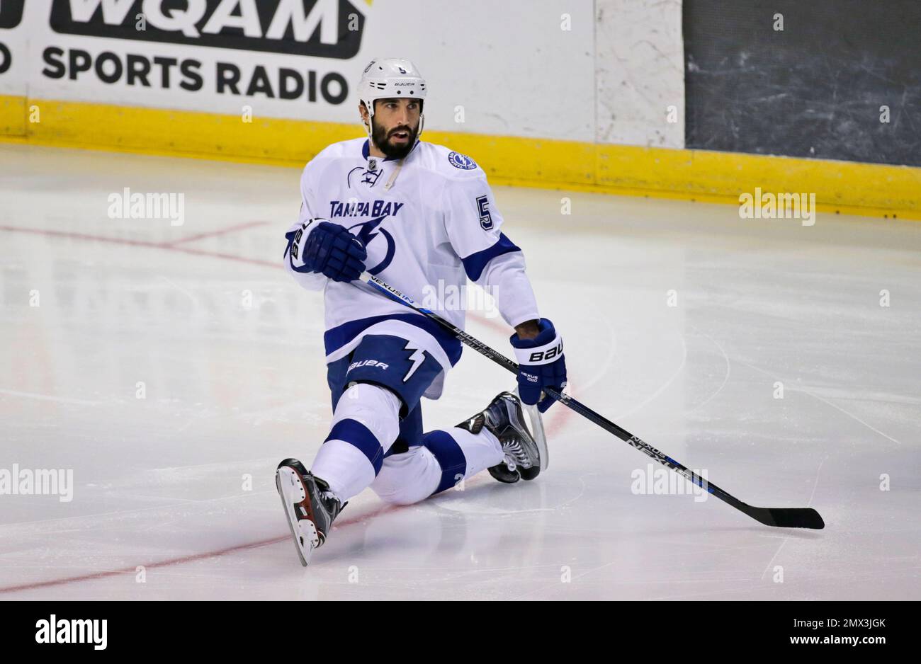 Tampa Bay Lightning defenseman Jason Garrison stretches out during