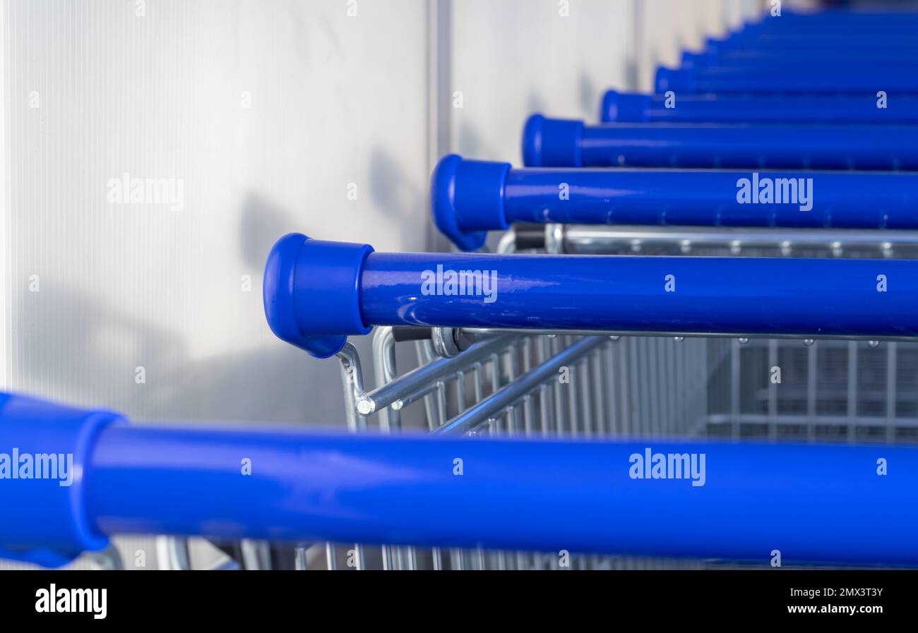 many trolley shopping cart with coin lock anti theft system Stock Photo