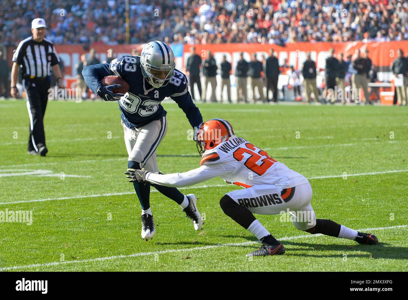 Dallas Cowboys wide receiver Terrance Williams (83) runs the ball against  Cleveland Browns cornerback Tramon Williams (22) in the first half of an NFL  football game, Sunday, Nov. 6, 2016, in Cleveland. (