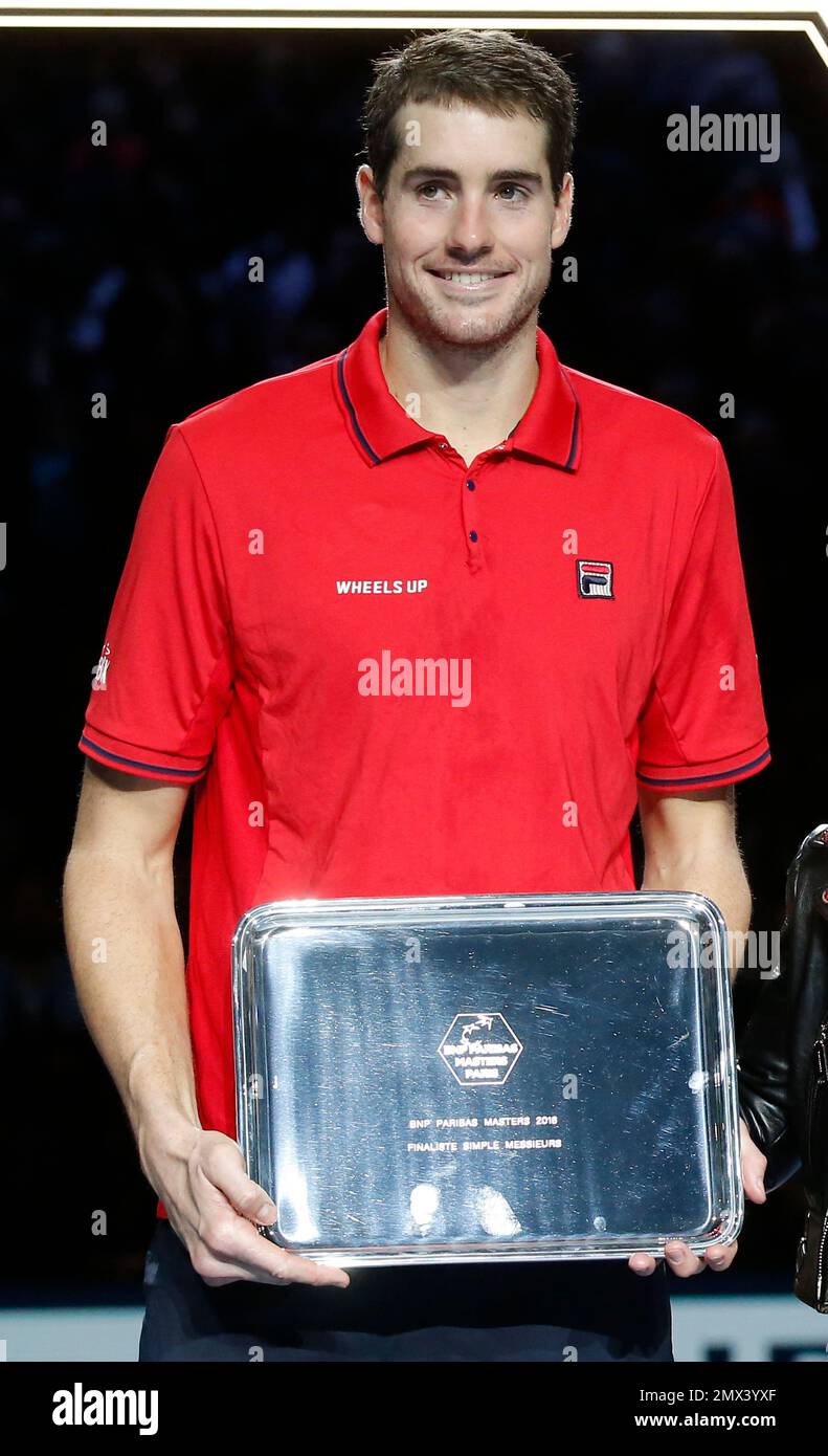 John Isner of the United States holds his trophy after the final of the  Paris Masters tennis tournament at the Bercy Arena in Paris, Sunday, Nov.  6, 2016. Murray won 6-3, 6-7,