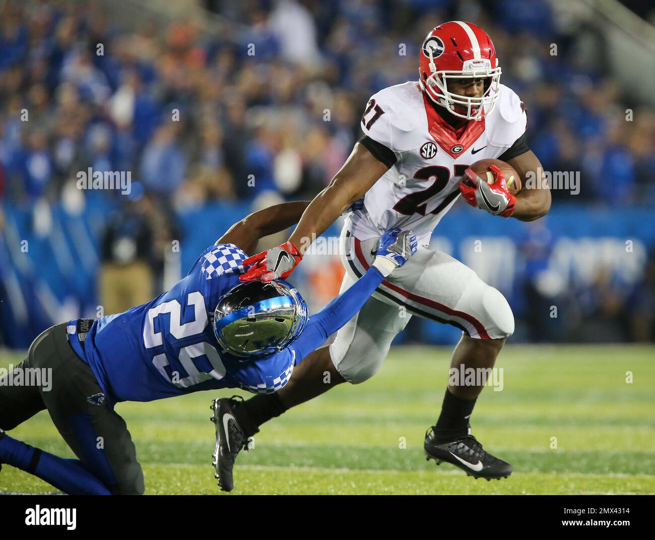 running back Nick Chubb slips past the grip of Kentucky