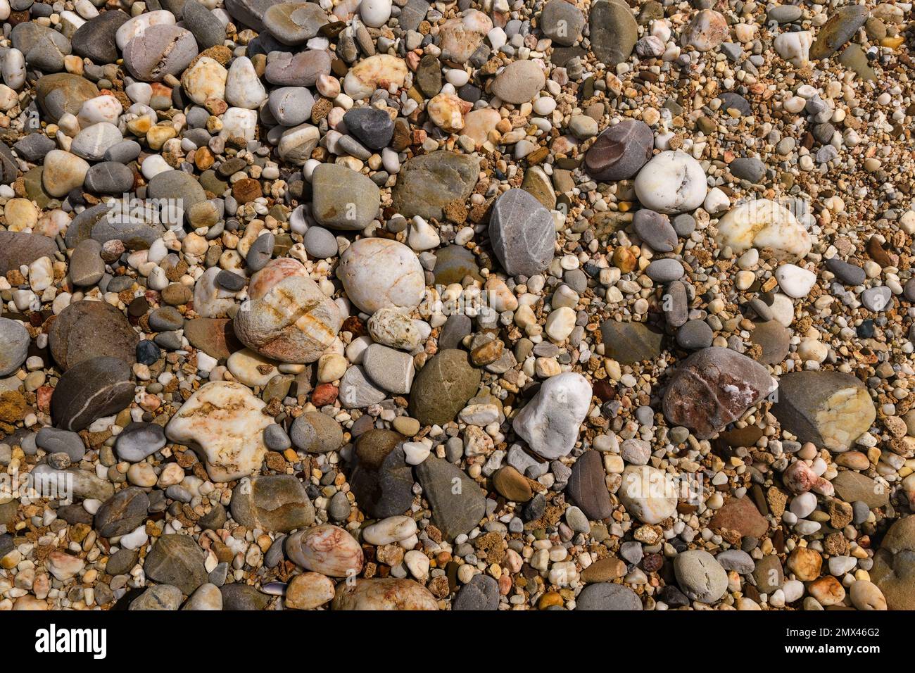 Colorful beach rocks, close up background texture. Stock Photo