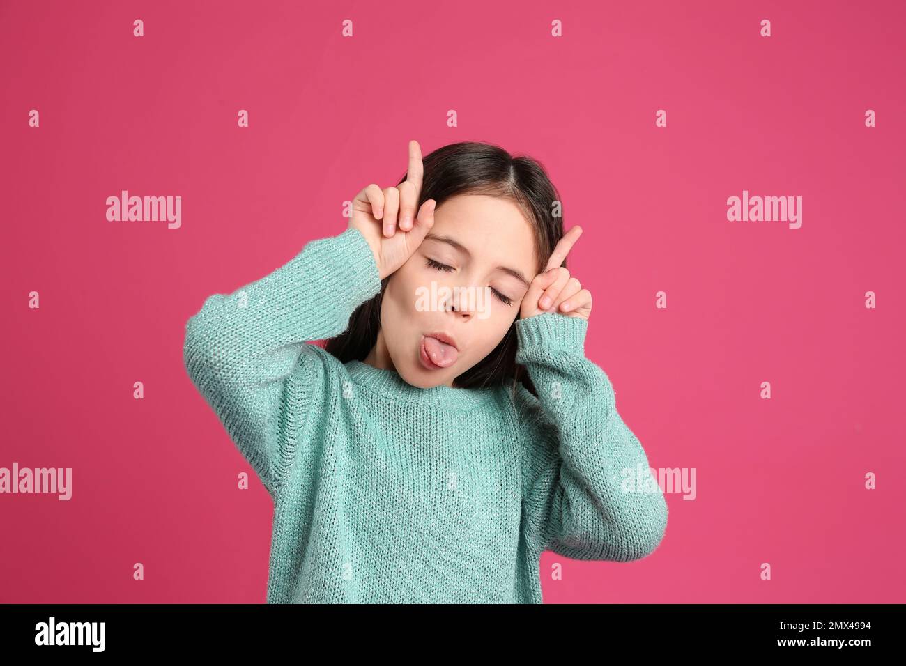 Portrait of cute little girl on pink background Stock Photo - Alamy