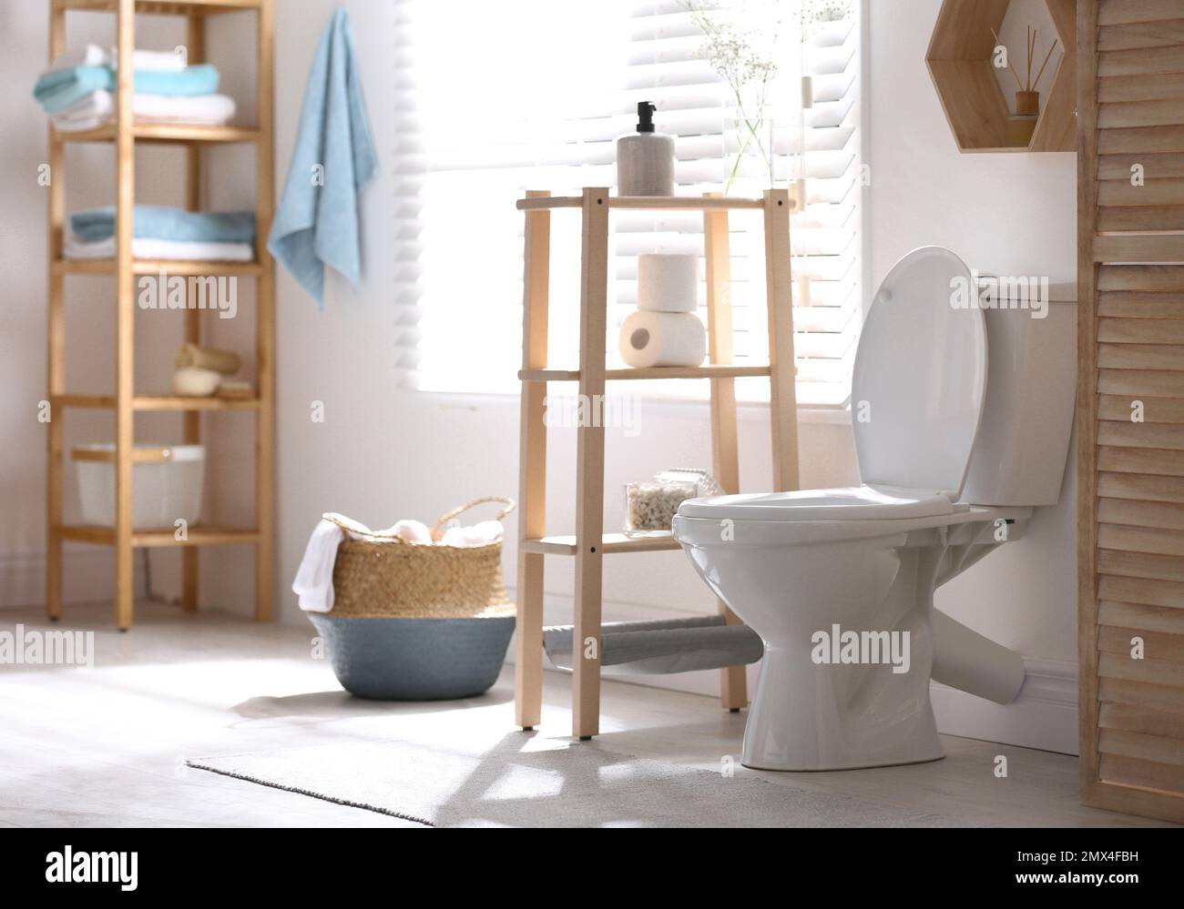 Modern toilet bowl in stylish bathroom interior Stock Photo - Alamy