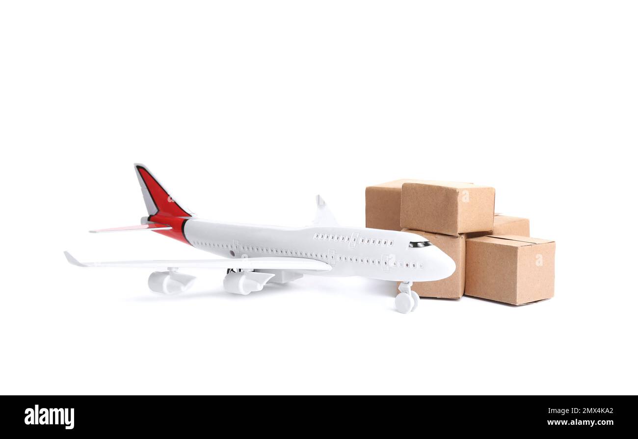 Airplane model and carton boxes on white background. Courier service