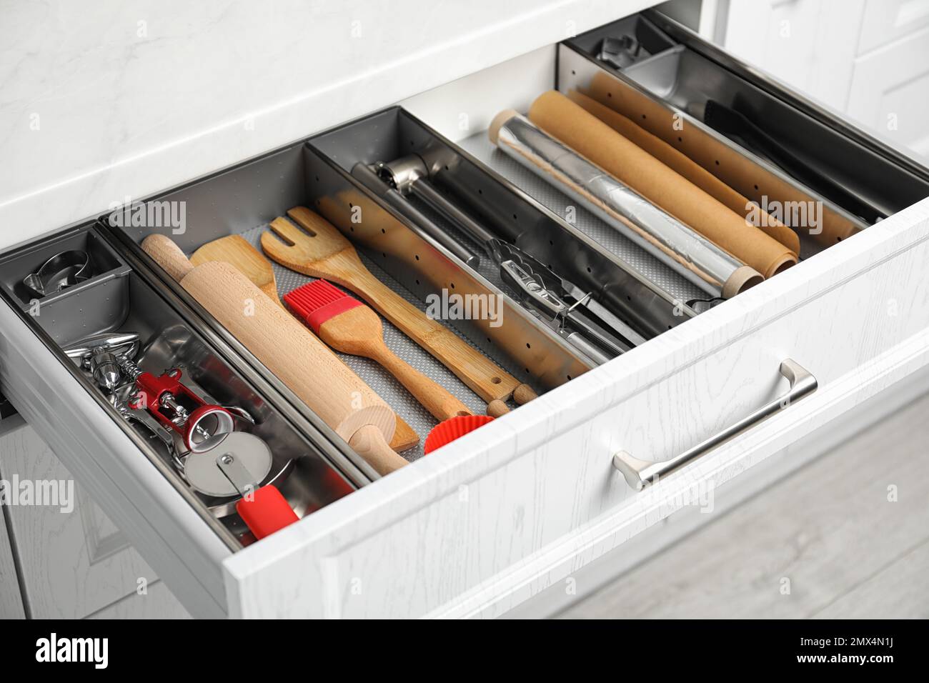 Different utensils in open desk drawer indoors Stock Photo Alamy