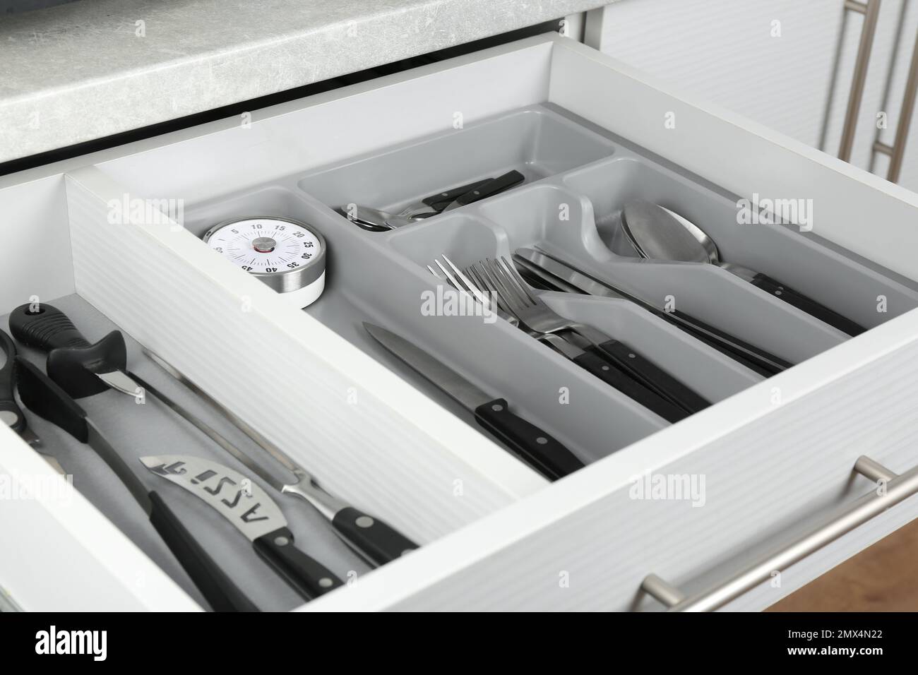 Open drawer with different utensils. Order in kitchen Stock Photo Alamy