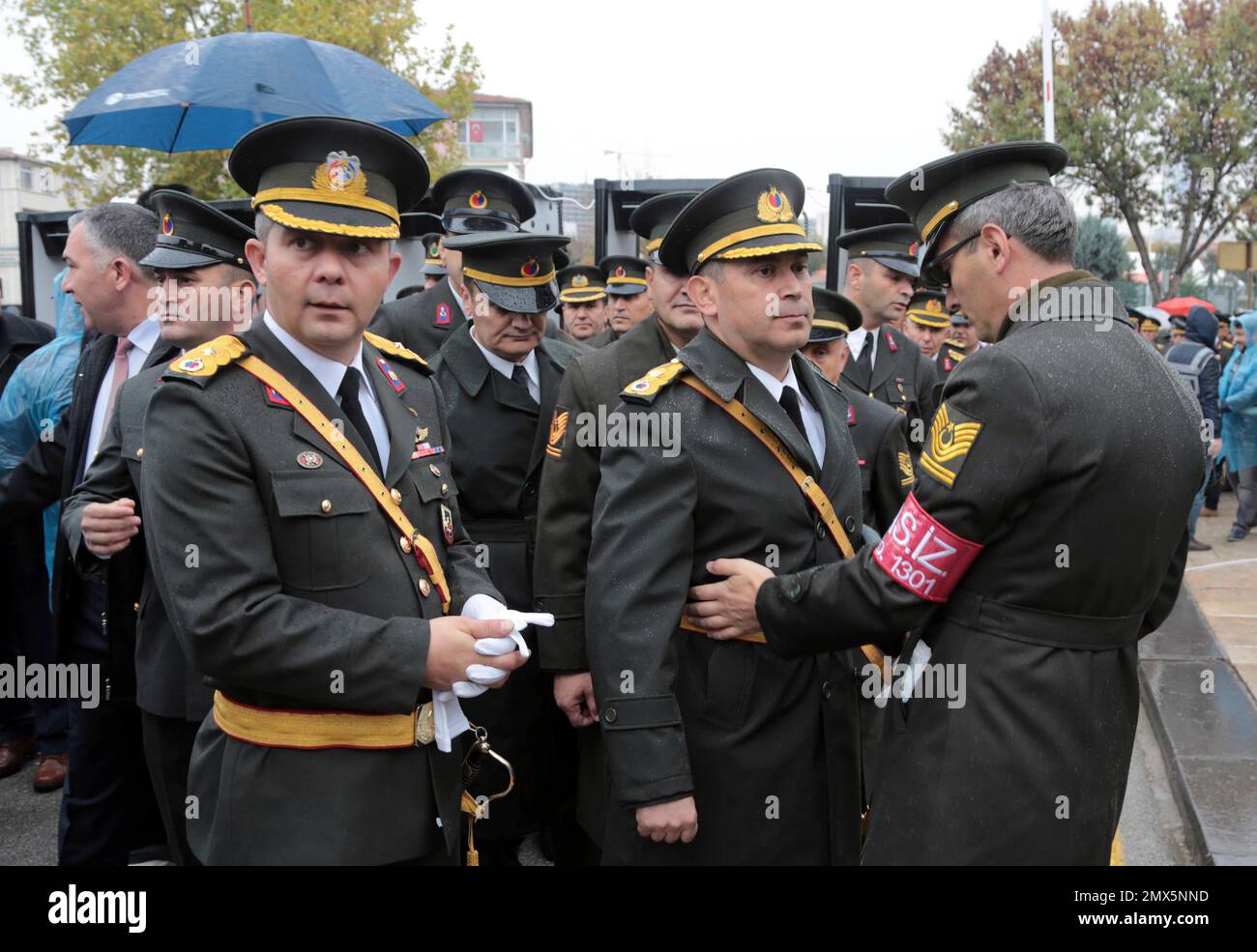 A Turkish army officer searches his colleagues and checks their IDs as