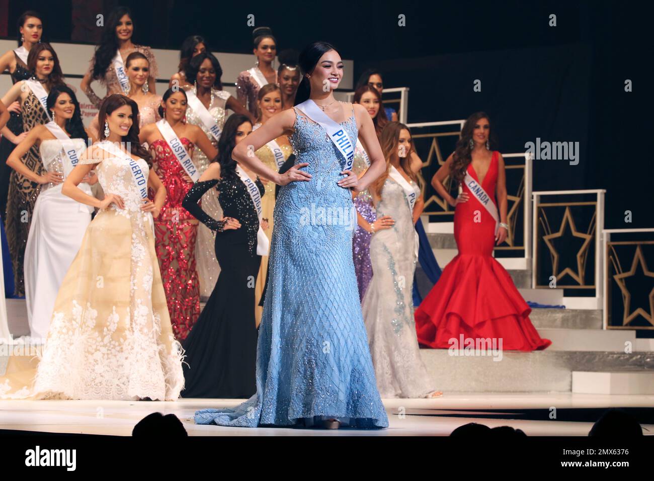 Miss Philippines Kylie Verzosa, Center, Poses On Stage During The Final ...