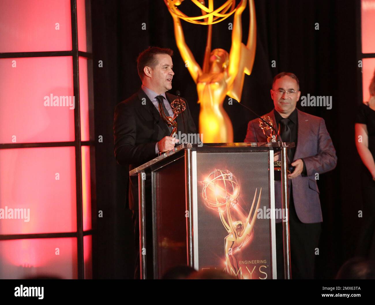 Howard Stark, left, and Glenn Sanders accept the Engineering Emmy on
