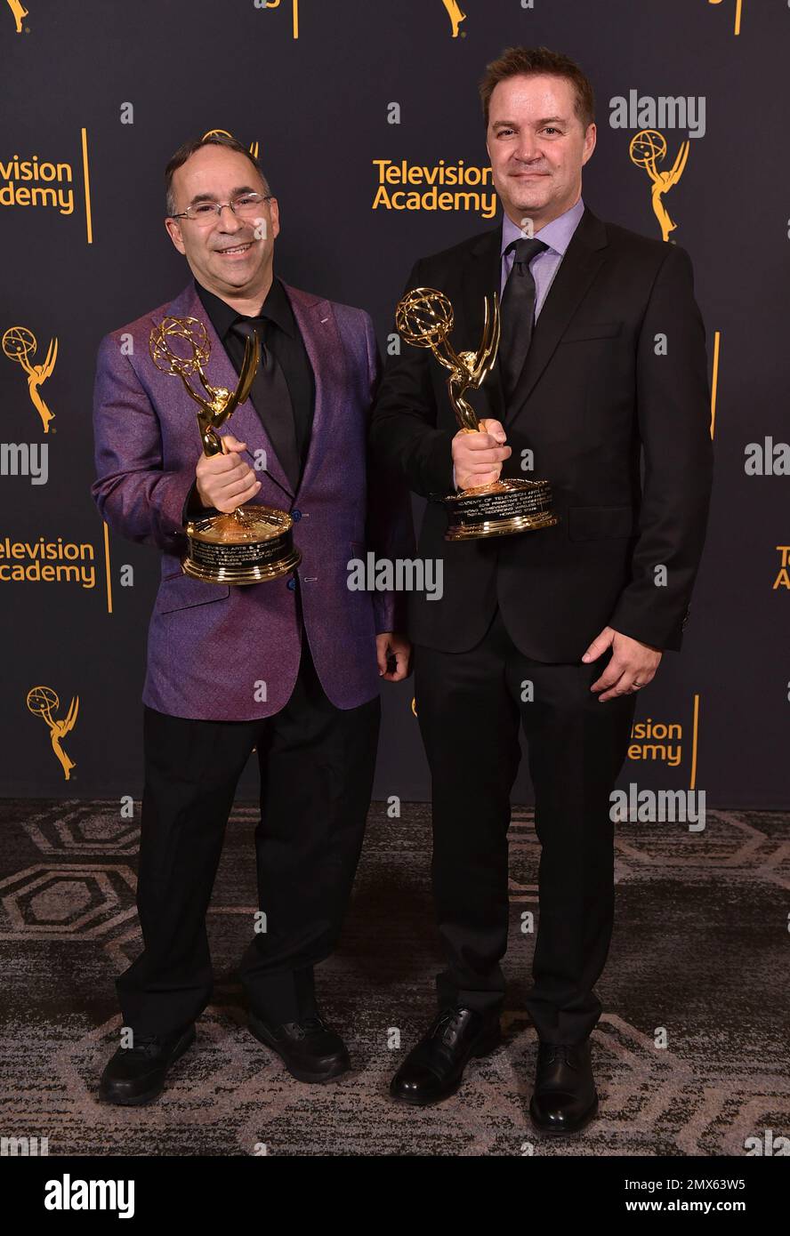 Glenn Sanders, left, and Howard Stark pose with the Engineering Emmy