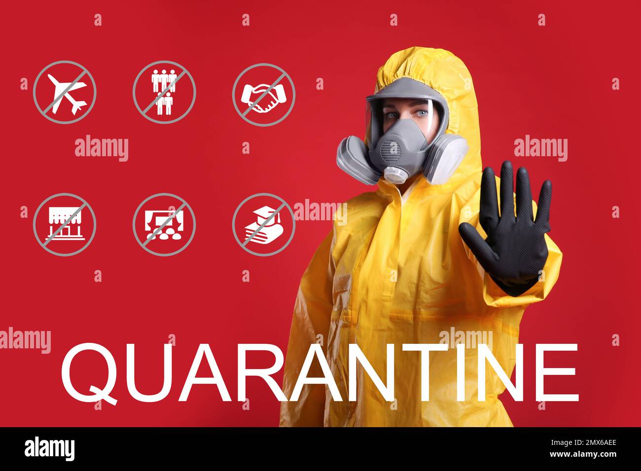Woman in chemical protective suit showing stop gesture against red background. Hold on