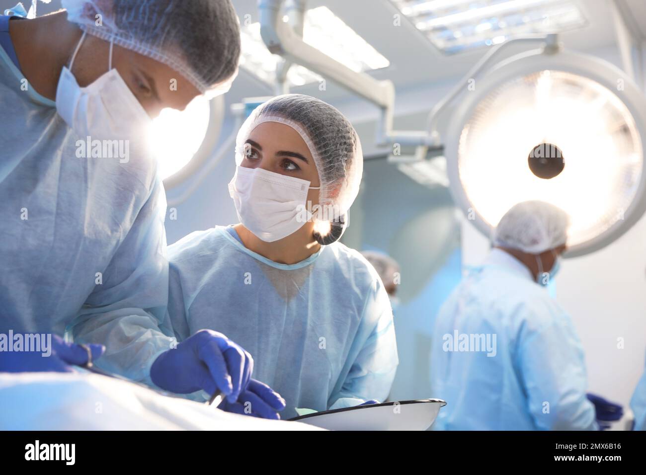 Surgeons performing an operation hi-res stock photography and images ...