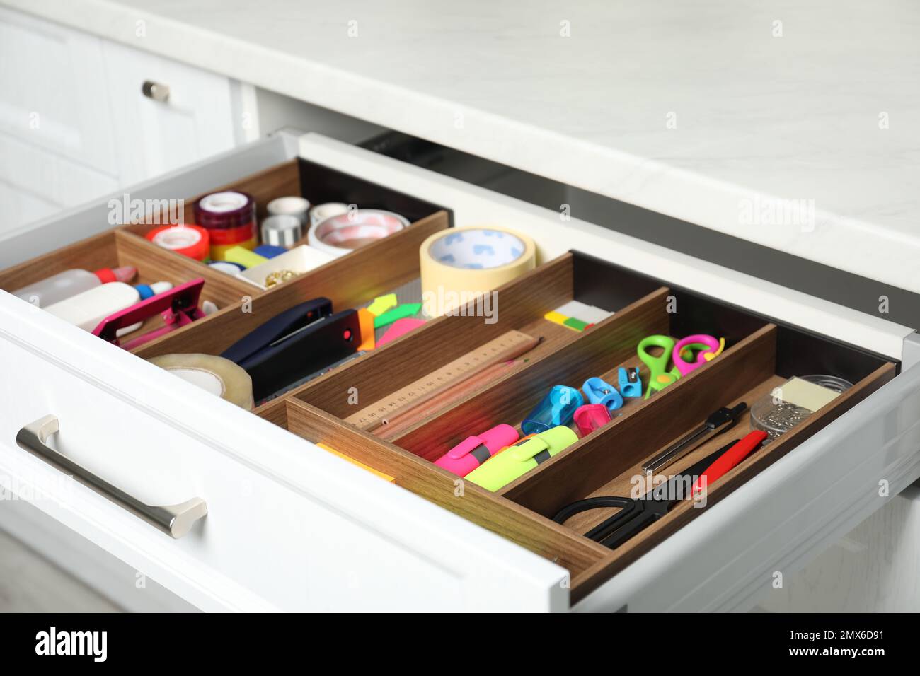 Different stationery in open desk drawer indoors Stock Photo Alamy