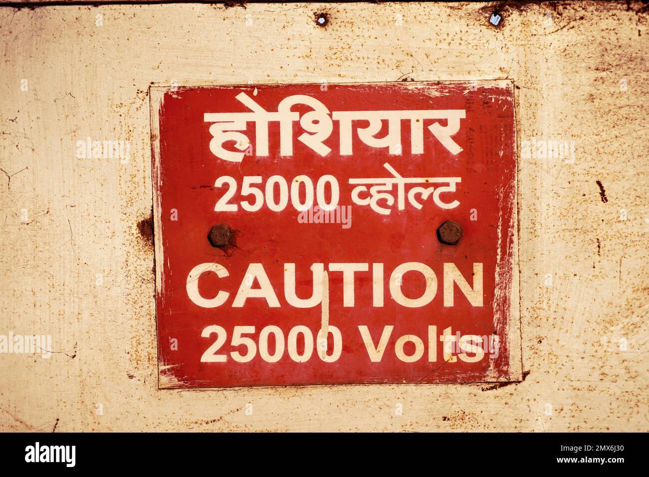 Caution 25000 high voltage safety warning sign board in red color and the instructions to communicate at work to say keep away from this place Stock Photo