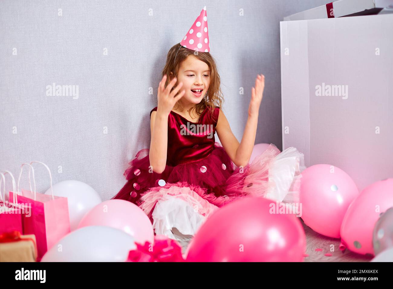 Beautiful Little Girl Blows Up Multicolored Confetti Having Fun At 