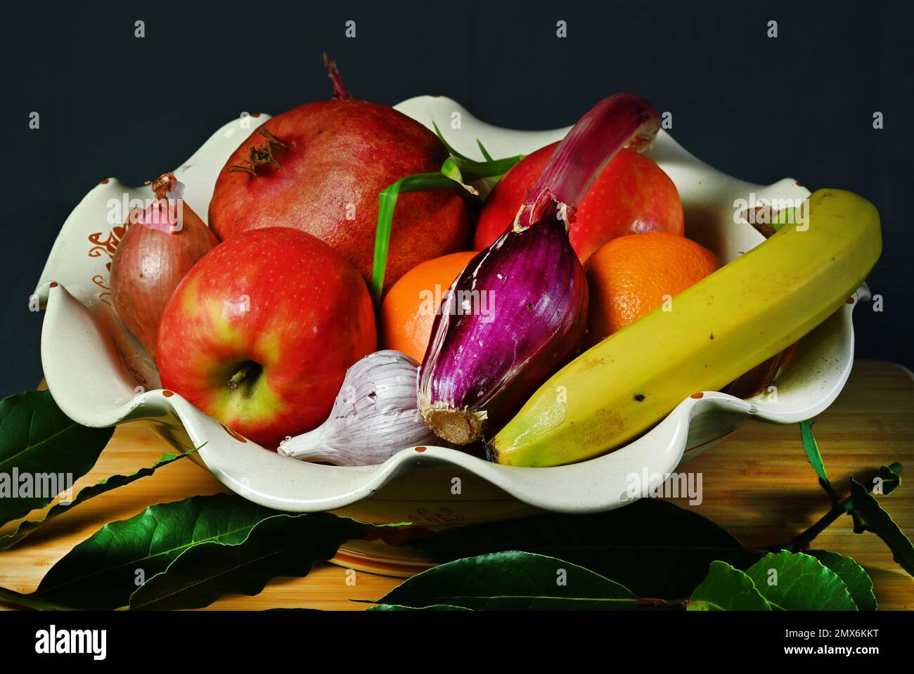 Composition in artificial lights of fruits and vegetables Stock Photo