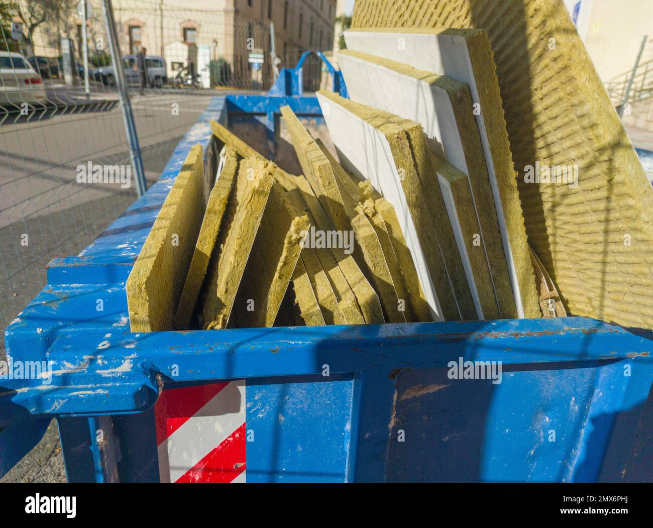 Dumpster full of glass wool slabs. Toilet management waste Stock Photo