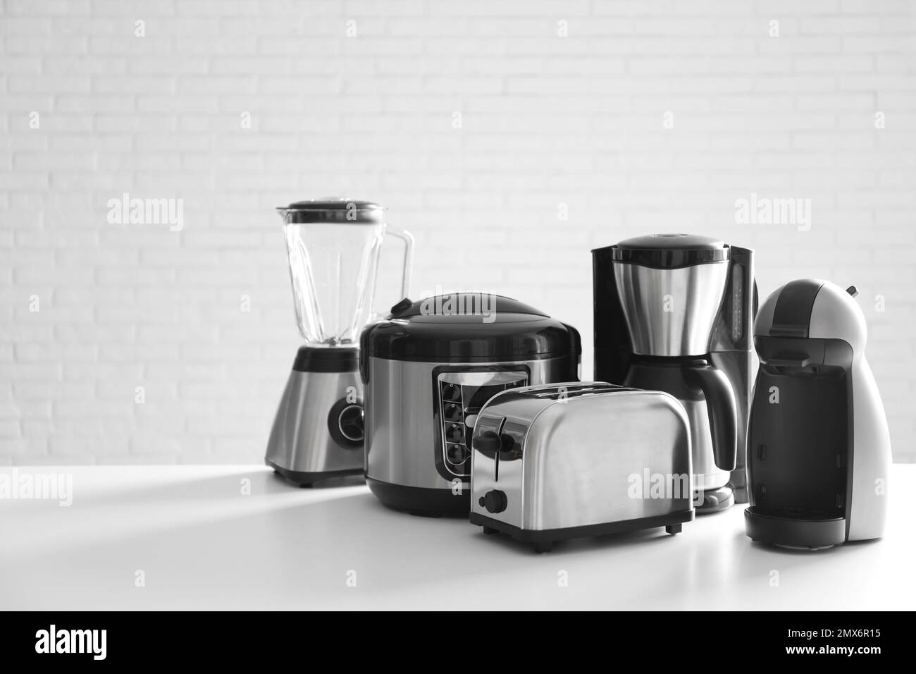 Kitchen Appliances Set. Red Blender, Toaster, Coffee Machine, Meat Ginder,  Food Mixer and Coffee Grinder on a wooden table. 3d Rendering Stock Photo -  Alamy