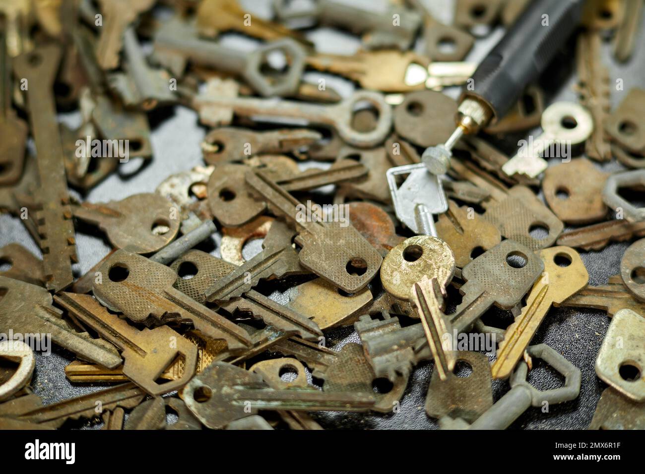 Keys set and lock concept with grinding engraving machine at the