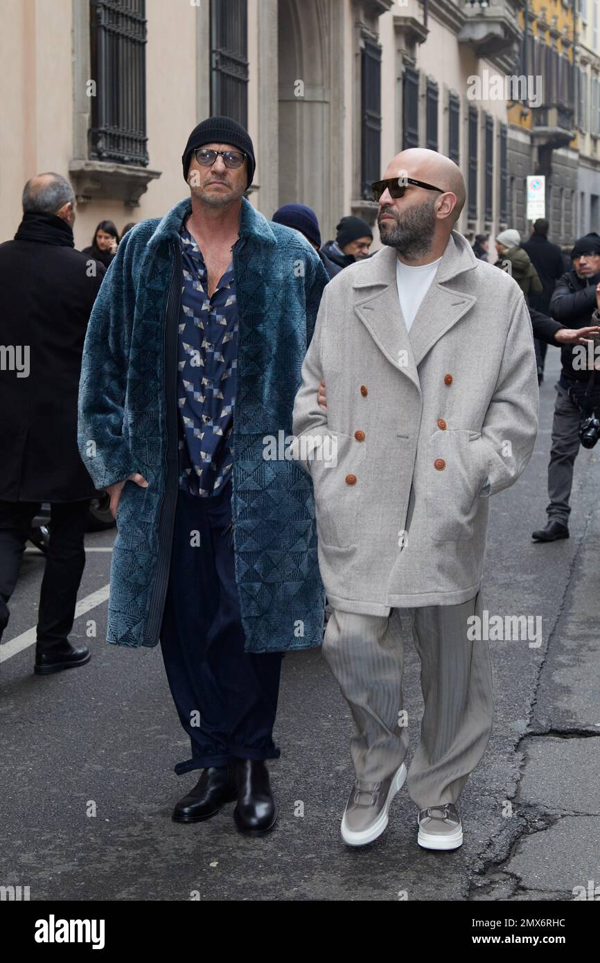 MILAN, ITALY - JANUARY 16, 2023: Biagio Antonacci and Giuliano Sangiorgi after Giorgio Armani fashion show, Milan Fashion Week street style Stock Photo