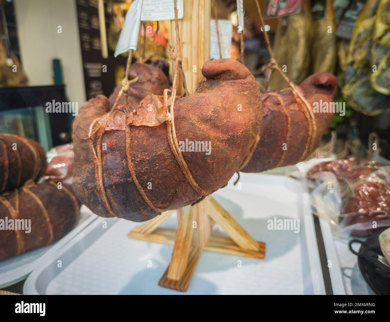 Extremaduran buche displayed at butchers shop. Pork stomach stuffed with ribs, tail, tongue and snout. Stock Photo