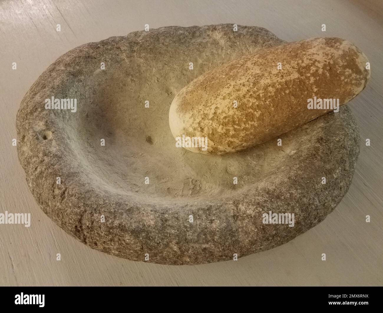 heavy stone or rock mortar and pestle set with powder Stock Photo Alamy