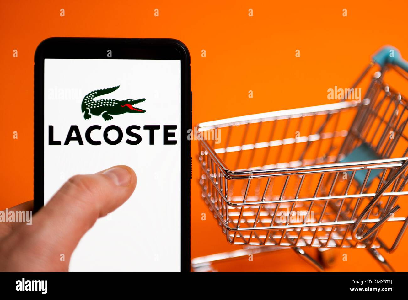 In this photo illustration a Lacoste logo seen displayed on a smartphone. (Photo by Mateusz Slodkowski / SOPA Images/Sipa USA) Stock Photo