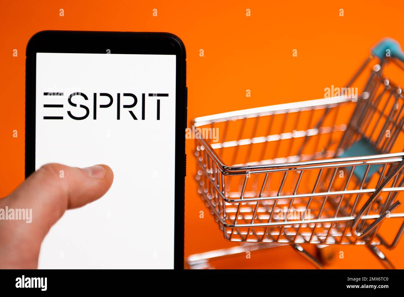 In this photo illustration an Esprit logo seen displayed on a smartphone. (Photo by Mateusz